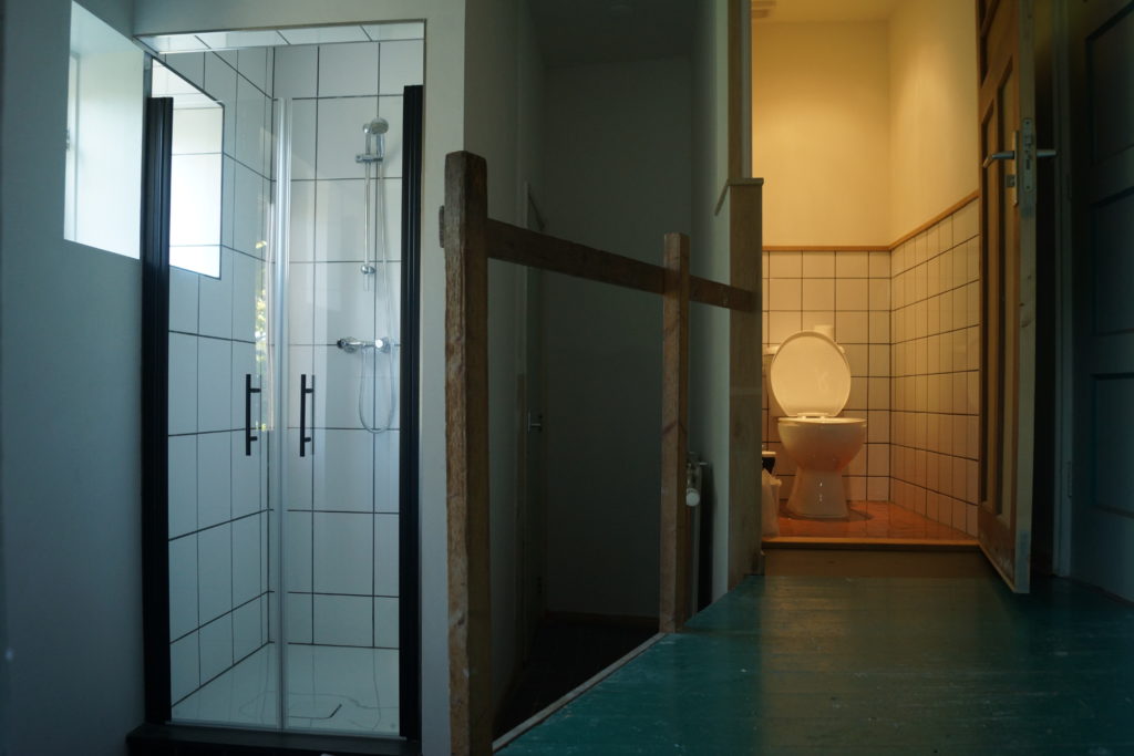 One of the shower/toilet areas